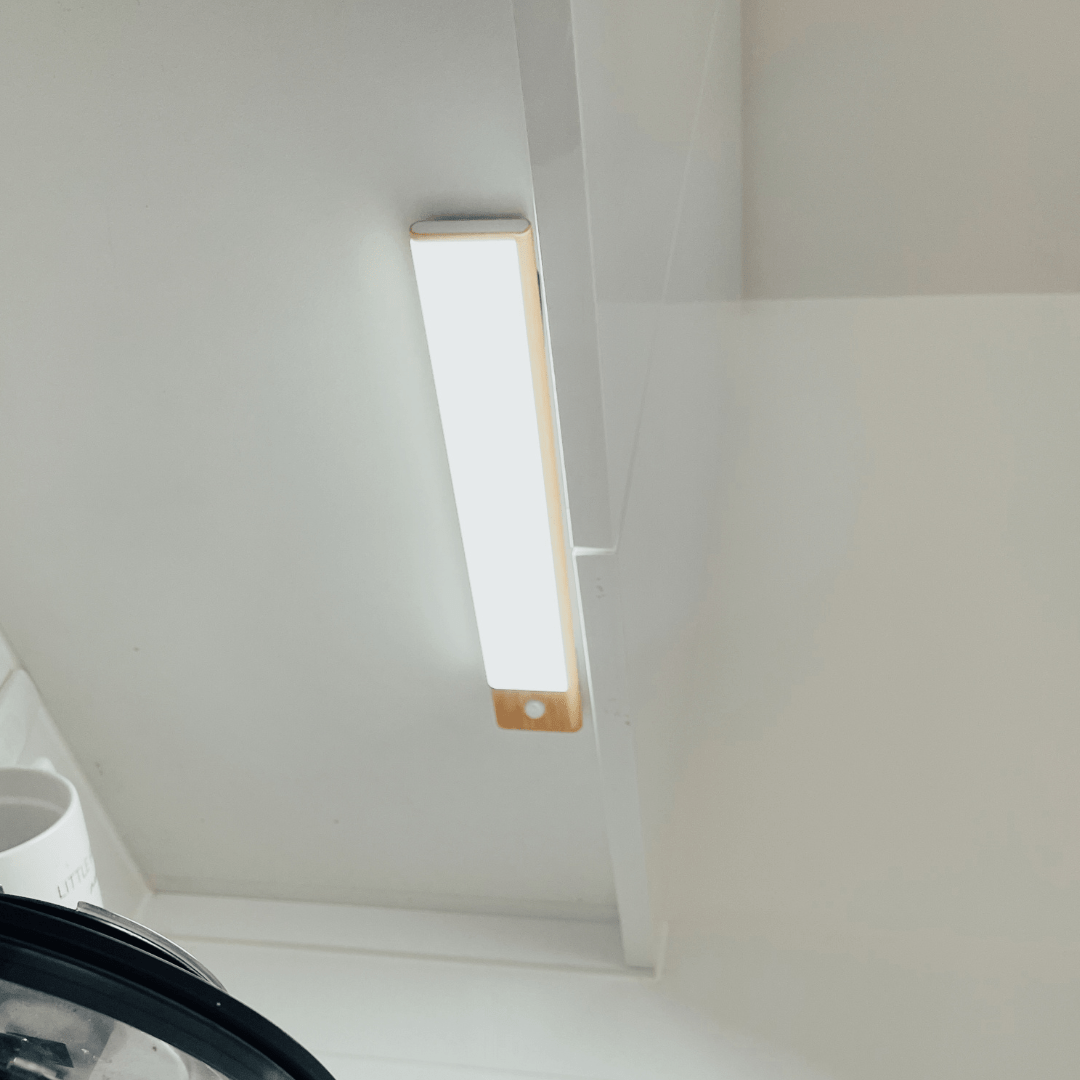 Modern smart sensor LED strip light mounted on kitchen ceiling